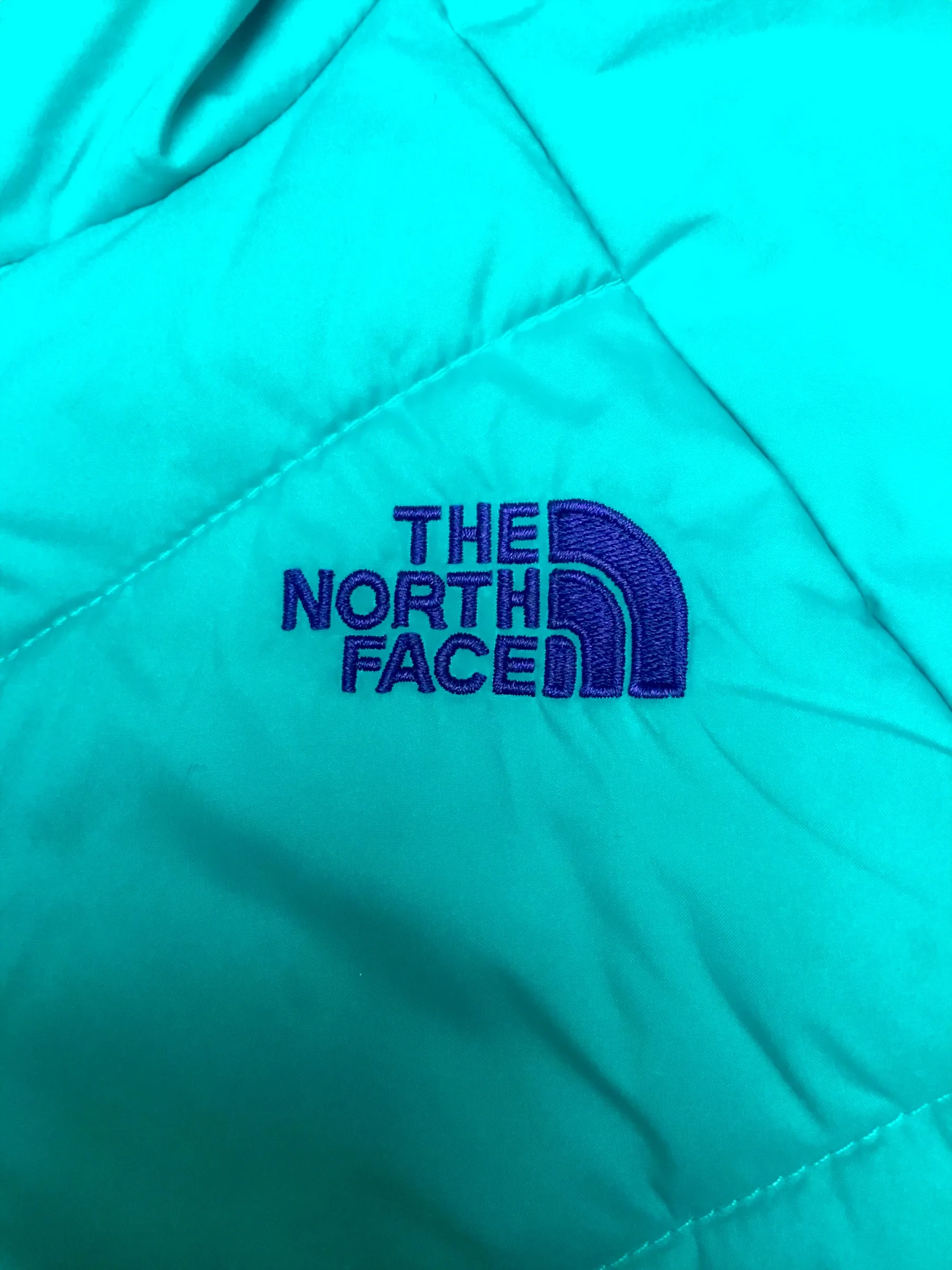 The North Face neon blue reversible hooded puffer jacket